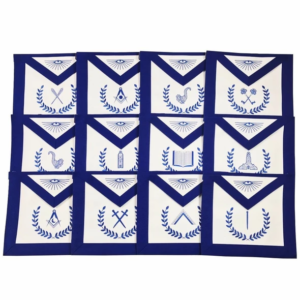 Masonic Blue Lodge Officers 12 Machine Embroidered Apron Set - Worshipful MasteråÊ - Senior WardenåÊ - Junior WardenåÊ - TreasureråÊ - SecretaryåÊ - Senior DeaconåÊ - Junior Deacon - Senior StewardåÊ - Junior Steward - Tyler / Tiler / Outer Guard - Inner Guard or Inside SentinelåÊ - ChaplainåÊ Features: Blue Lodge Set of 12 Adjustable belt with Silver plated snakeåÊfitting Finest quality royal blue ribbon Finest Quality Machine Embroidery Complete color shade Guarantee Pocket at the rear and soft padding Size: 14‰۪‰۪åÊX 16'' Available in Imitation Leather and Lambskin